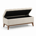 Banc de rangement en tissu bouclé beige avec pieds en bois